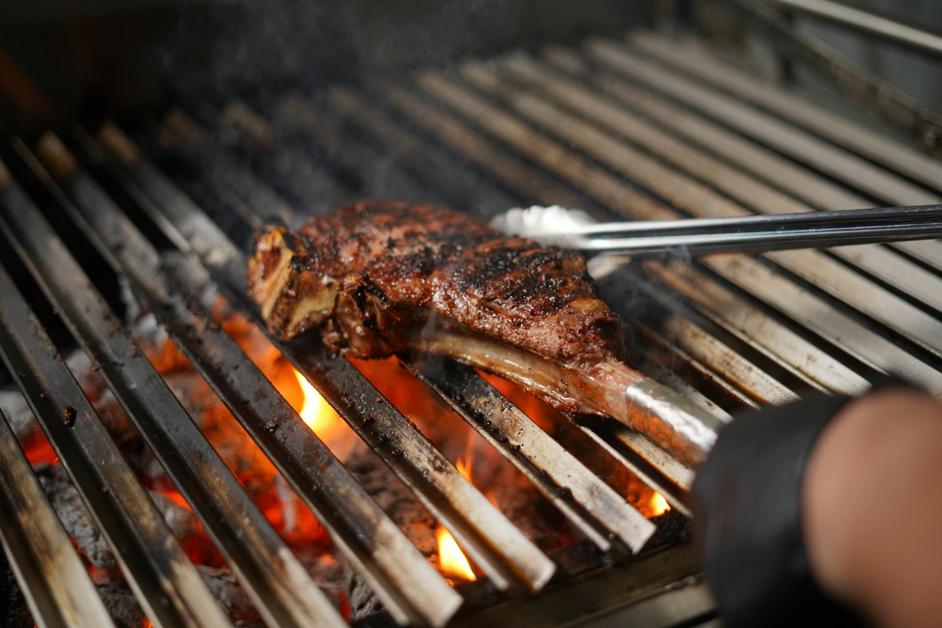 Meat with Bone on a Flaming Grill